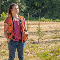 Portrait of Sara Lipow in uniform on Roseburg Forest Products forest genetics worksite.