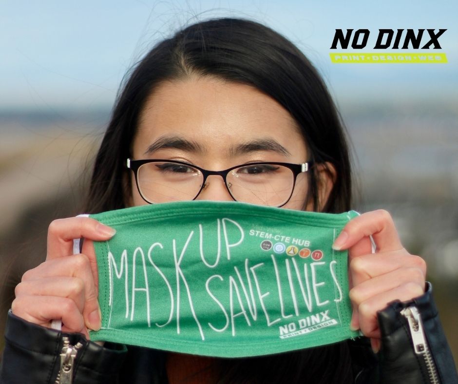 Our intern, Daisy Truong, wearing a Mask Up, Save Lives mask