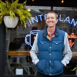 Portrait of Trinia in front of Hinterland Empire storefront 