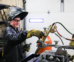 female welding student